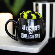 Load image into Gallery viewer, Strange &amp; Unusual Mug and Socks Set
